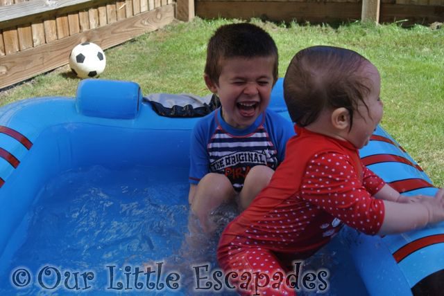 ethan laughing little e paddeling pool July 2015
