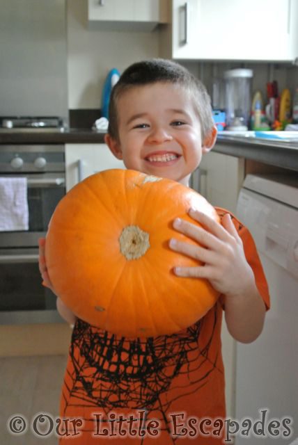 ethan holding pumpkin