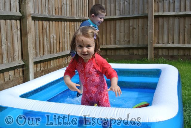 little e ethan playing paddling pool