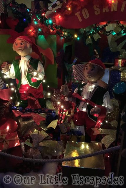 elves gift wrapping grotto scene