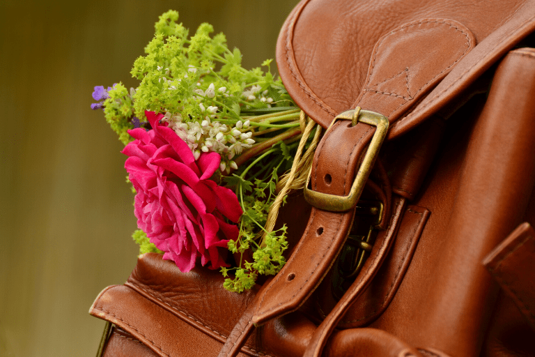 brown leather backpack red flowers