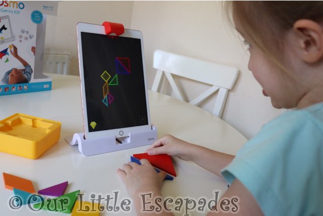 little e playing tangram home learning with osmo