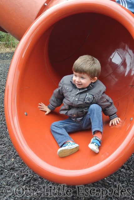 ethan sliding down red slide colchester zoo playground