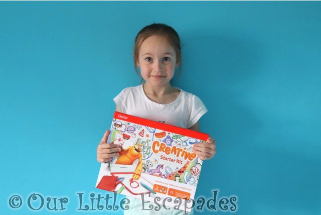 little e holding osmo creative starter kit box