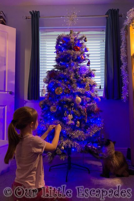 little e decorating christmas tree