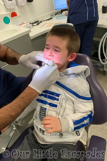 dentist checking ethans teeth