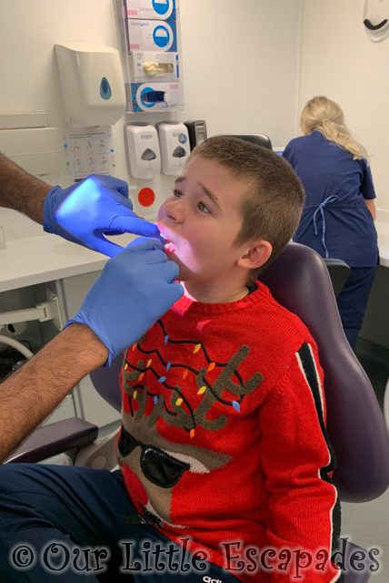 dentist checking ethans wobbly tooth