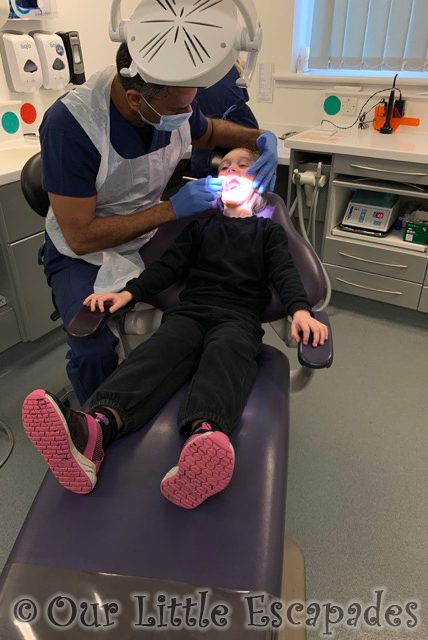 dentist checking little es teeth