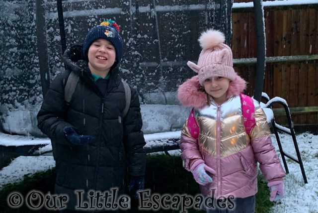 ethan little e smiling snowy garden snowy walk to school