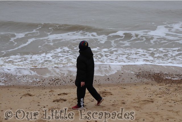 ethan walking along frinton-on-sea beach first walk of 2021
