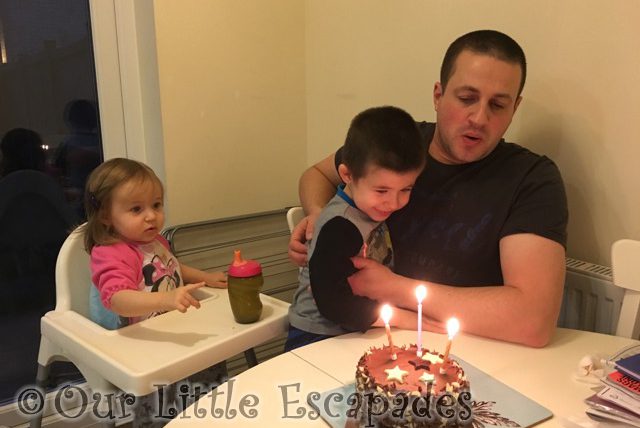 little e ethan darren blowing out candles birthday cake