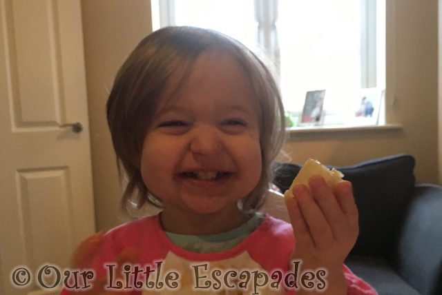 little e laughing eating banana featured image