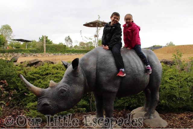 ethan little e sitting on fake rhinoceros colchester zoo