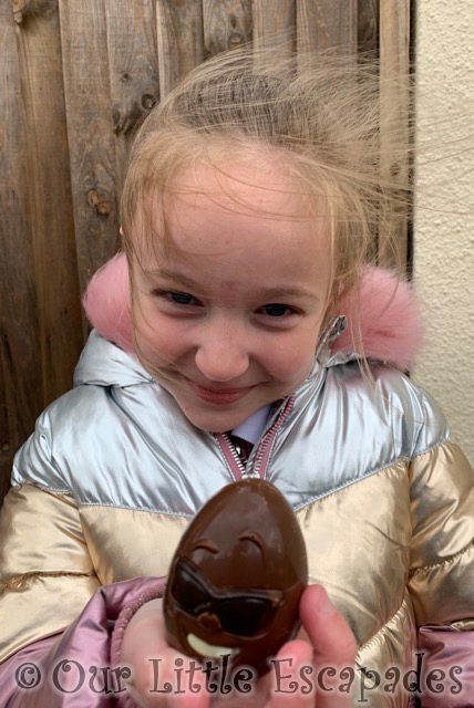 little e holding chocolate egg with face 2021 Week 20