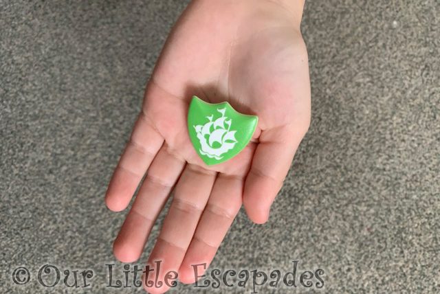 green blue peter badge little es hand