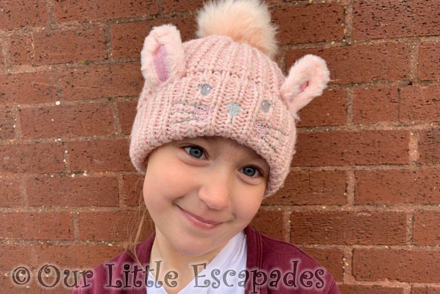 little e wearing pink bunny woolly hat
