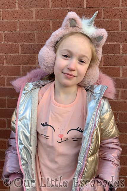 little e wearing cat face pink jumper