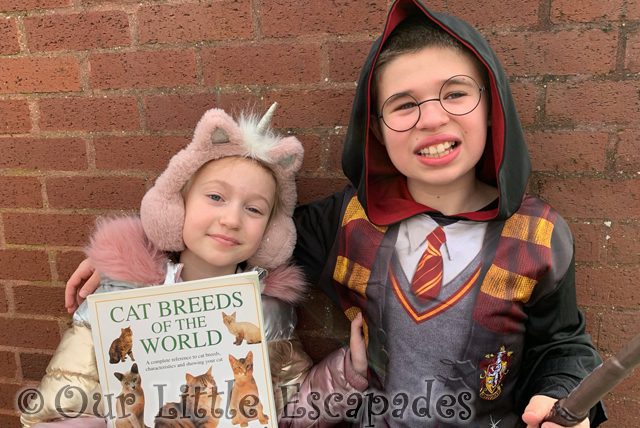 little e holding cat book ethan dressed harry potter
