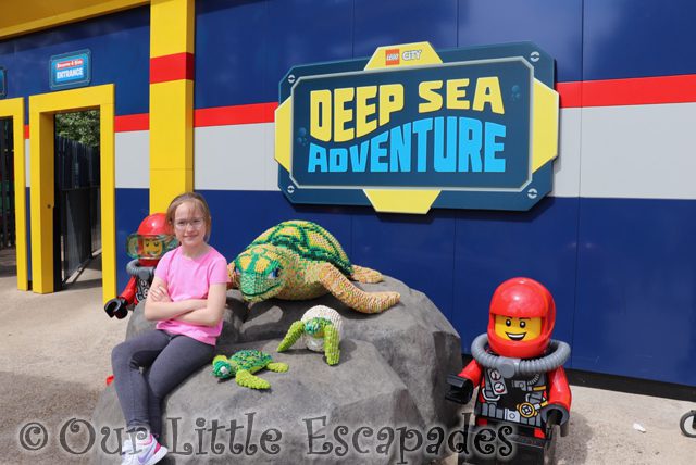 little e sitting lego turtle lego city deep sea adventure sign legoland windsor
