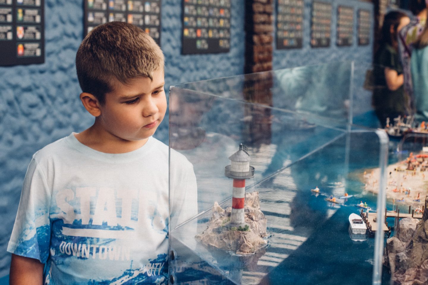 boy looking at the lighthouse