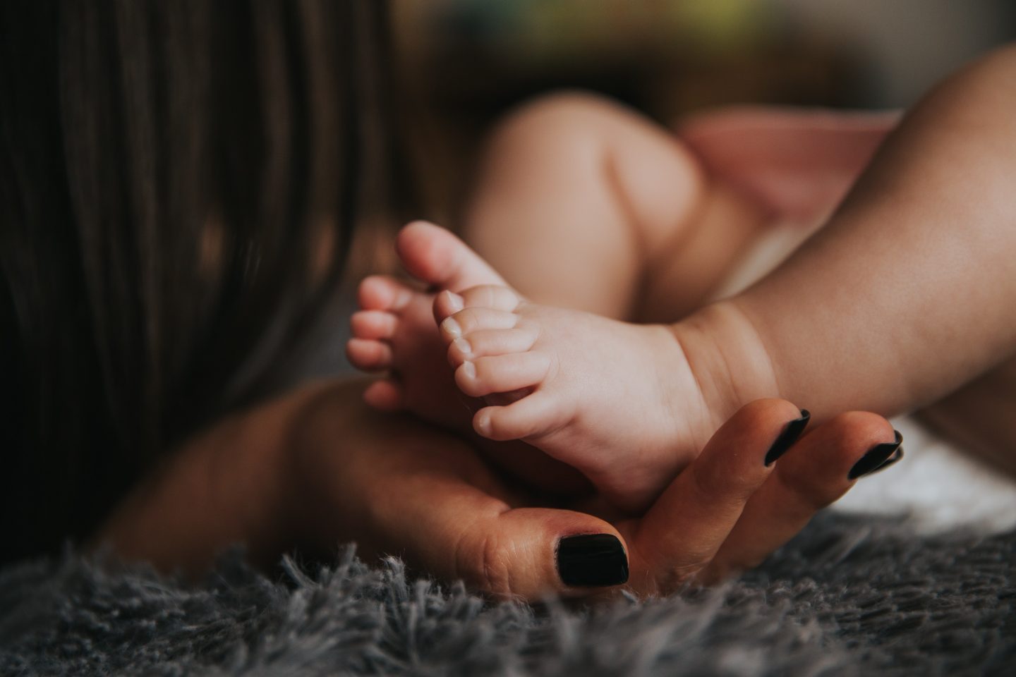 hand holding baby feet