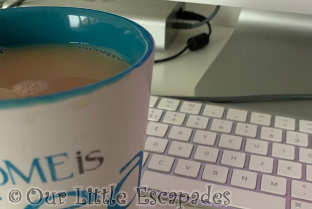cup tea keyboard desk