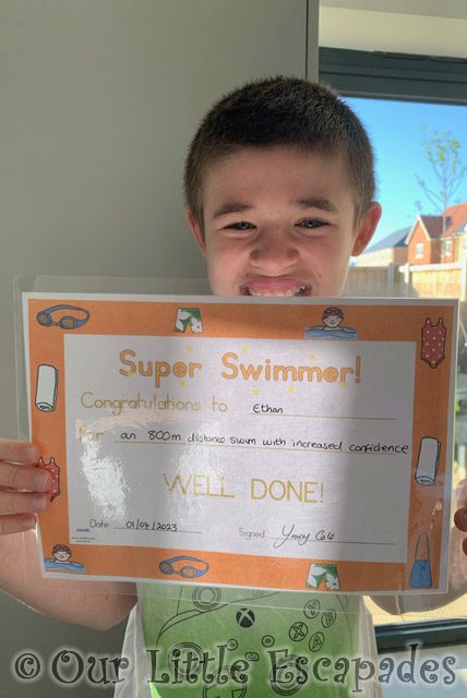 ethan holiding 800 metres swimming certificate project 365 2023