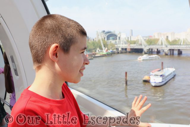 ethan looking out london eye capsule charing cross station