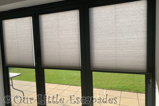 grey bi-fold window blinds